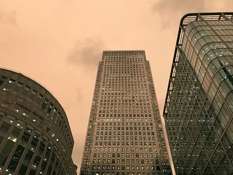 Skies over London's financial centre Canary Wharf are given a yellow glow as dust from the Sahara desert and wild fires in Spain, blown across the city by Storm Ophelia, filters out the light, in London, Britain October 16, 2017. 