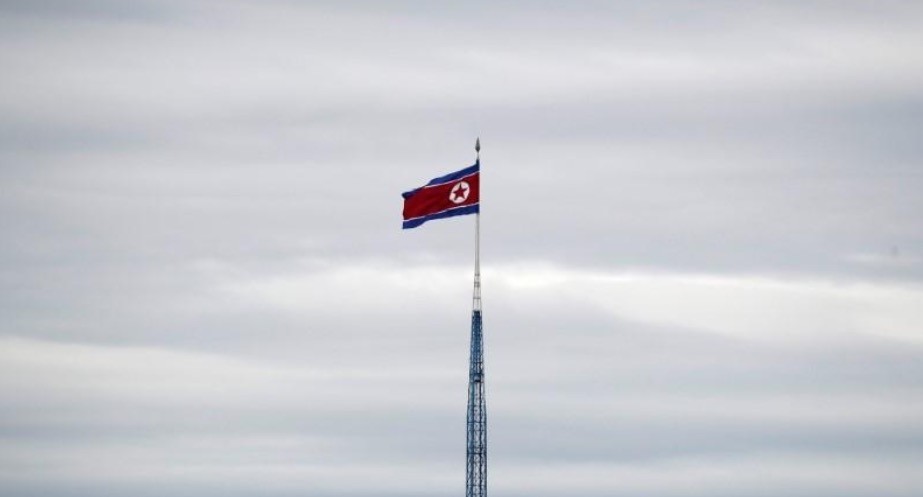 A North Korean flag flutters on top of a 160-metre tower in North Korea's propaganda village of Gijungdong (Reuters Photo)