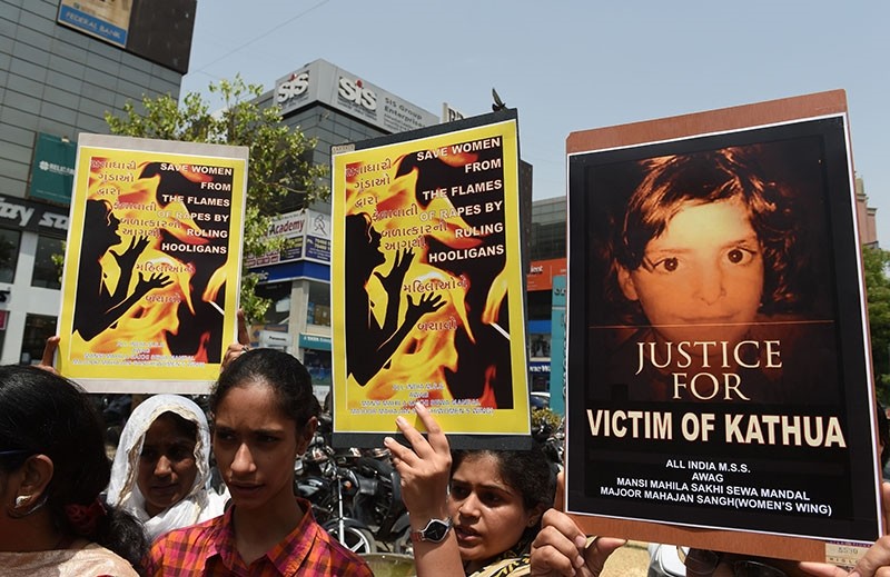 Indian activists and students protest over the rape of a child near Jammu and a rape case in Uttar Pradesh state, in Ahmedabad on April 13, 2018. (AFP Photo)