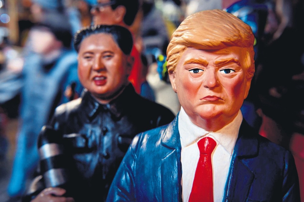 Statuettes of U.S. President Trump and North Korean leader Kim Jong Un holding a missile, in a shop, Naples, Italy, Dec. 14. 