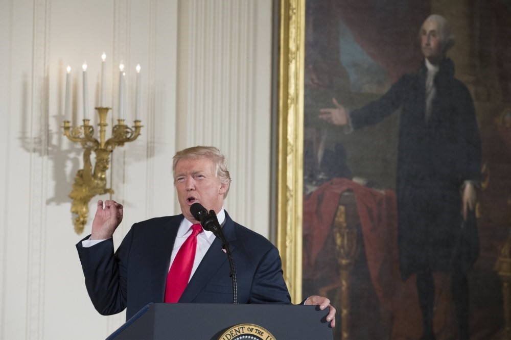 President Trump delivers remarks beside a portrait of George Washington during a ceremony in the East Room of the White House in Washington, D.C., July 31.