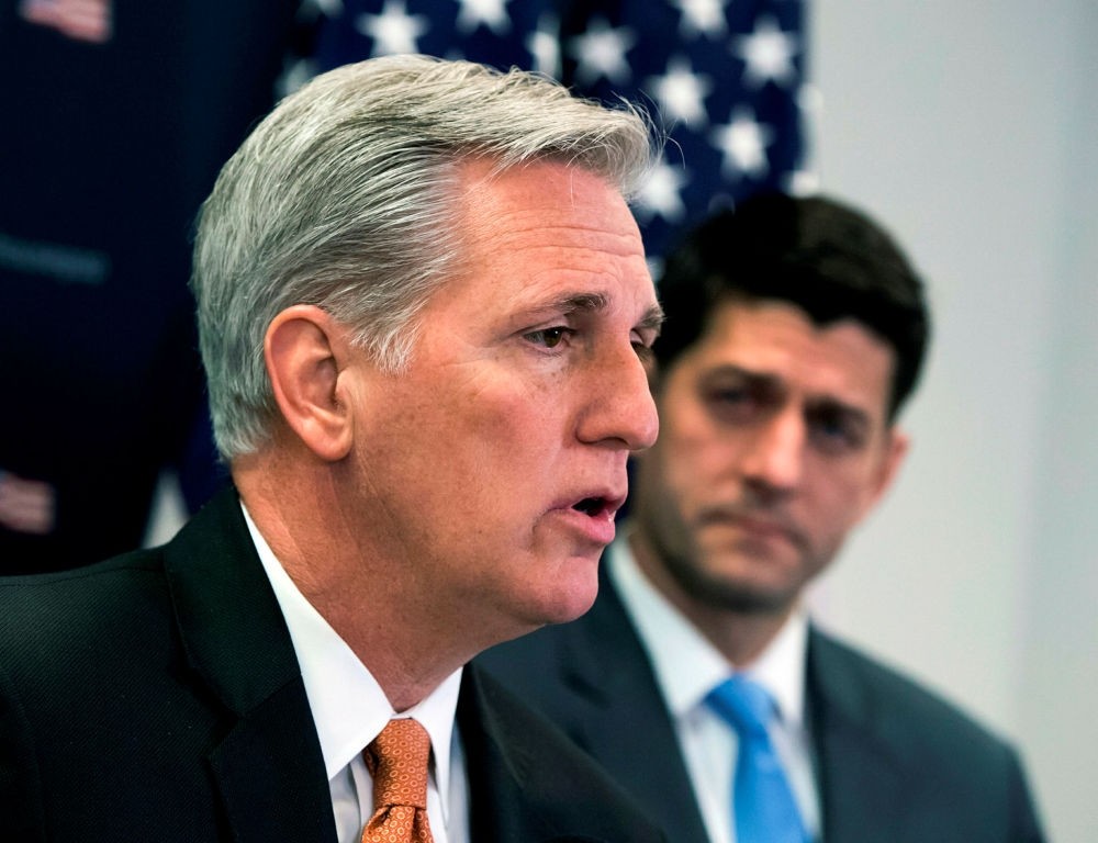 Representative Kevin McCarthy (L) joined by Speaker of the House  Paul Ryan talks with reporters at the U.S. Capitol in Washington, Feb. 6.