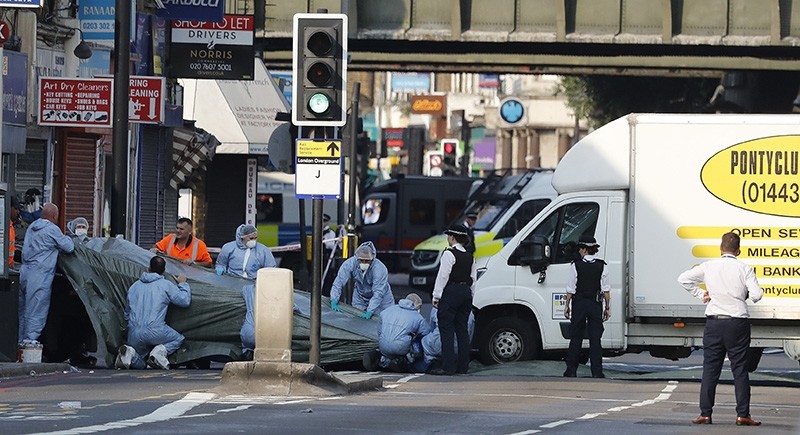 In this file photo dated Monday, June 19, 2017, forensic officers move the van which struck pedestrians near a Mosque at Finsbury Park in north London. (AP Photo)