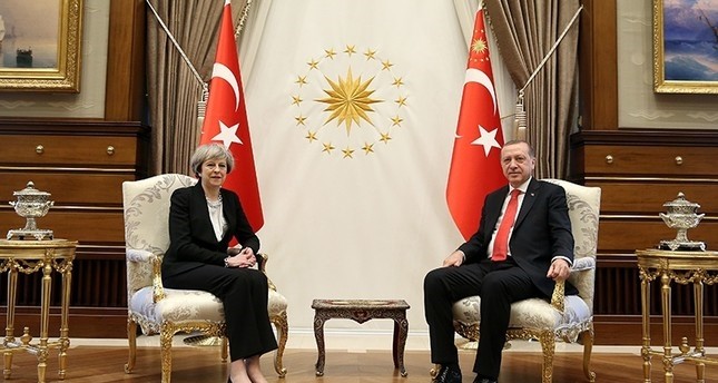 President Recep Tayyip Erdou011fan, right, poses for the photographers with British Prime Minister Theresa May, prior to their meeting at the Presidential Complex in Ankara (AP Photo)
