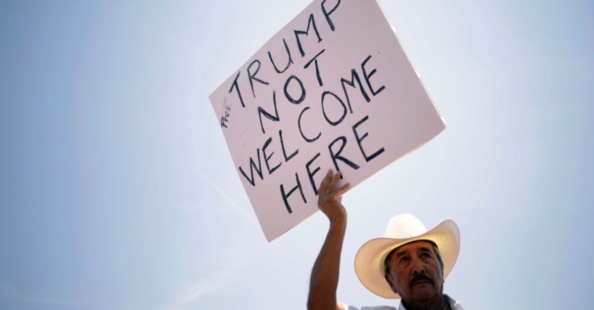 A man takes part in a rally against the visit of the U.S. President Donald Trump after a mass shooting at a Walmart store, in El Paso, Texas, U.S., August 7, 2019. (Reueters Photo)