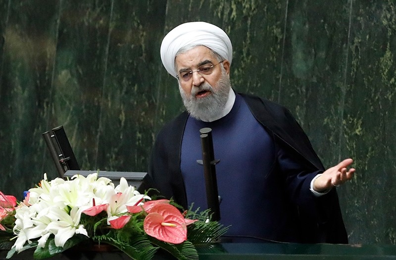 Iranian President Hassan Rouhani (C) delivers a speech to the parliament in Tehran on Aug. 20, 2017, as Iran's parliament prepares to vote on the President's cabinet. (AFP Photo)