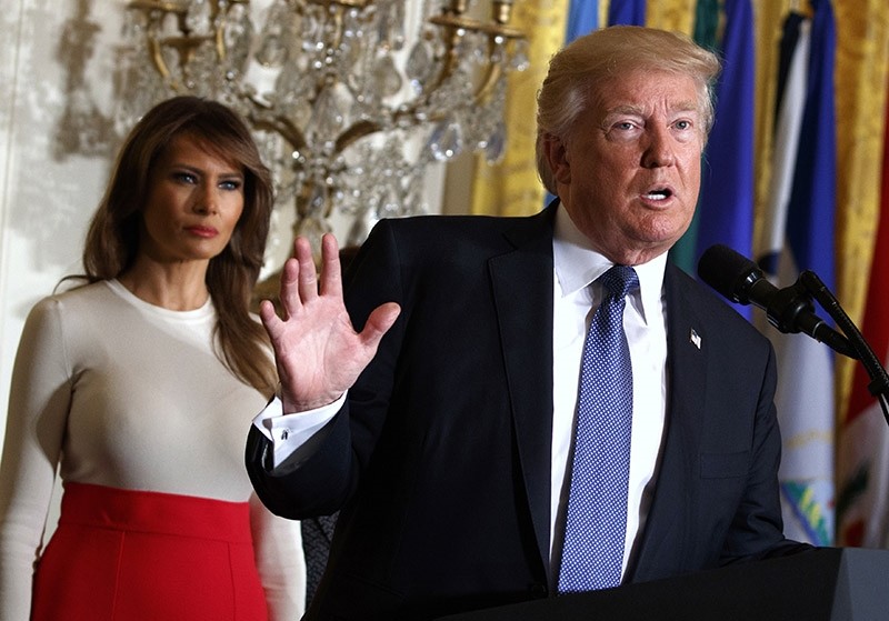 President Donald Trump speaks during an event at the White House in Washington, as first lady Melania Trump listens. (AP Photo)