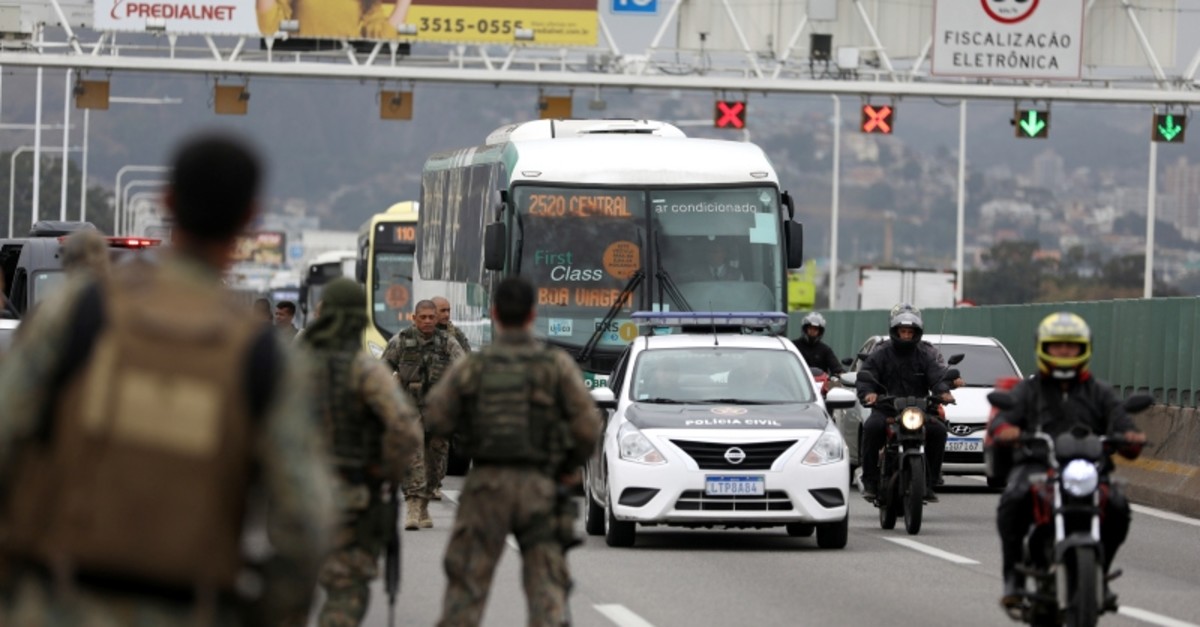 Police officers are seen on the Rio-Niteroi Bridge, where security forces shot dead a man who hijacked a commuter bus in Rio de Janeiro, Brazil August 20, 2019. (Reuters Photo)