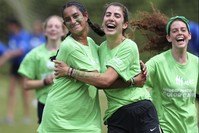 Campers from the United States, left, and the United Kingdom hug after their team won a soccer game at the Seeds of Peace camp.