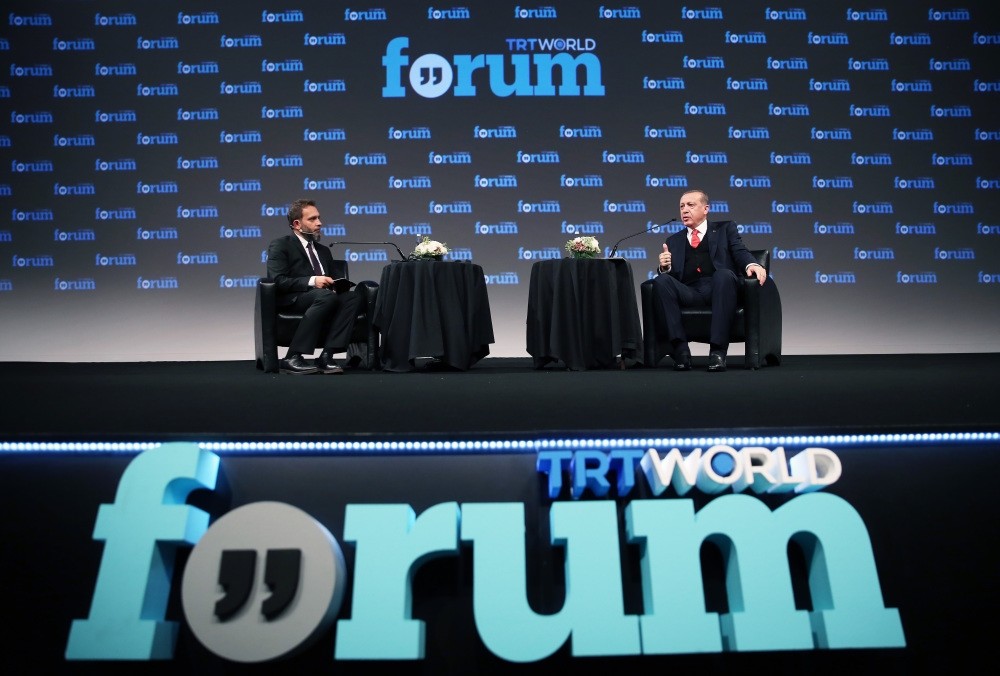 President Recep Tayyip Erdou011fan(R) speaks at the TRT World Forum and answers questions from Fatih Er(L), the TRT World News Coordinator.