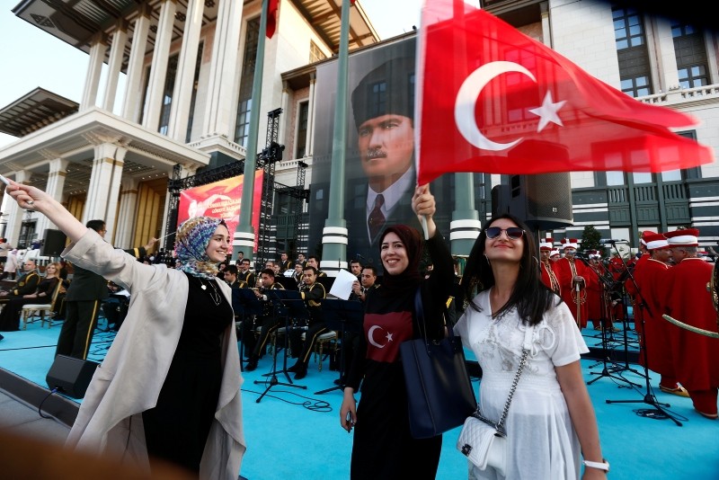 Supporters of President Erdoğan, pose for photographs following a ceremony at the Presidential Complex July 9, 2018.