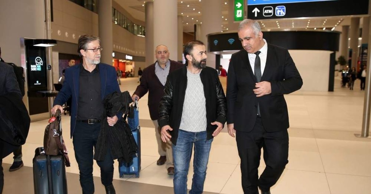 Hilmi Balcu0131 was greeted by Anadolu Agency officials upon his arrival at Istanbul Airport, Jan. 17, 2020. (AA Photo)