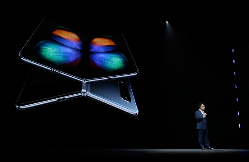 DJ Koh, Samsung President and CEO of IT and Mobile Communications, talks about the new Samsung Galaxy Fold smartphone during an event Wednesday, Feb. 20, 2019, in San Francisco. (AP Photo)