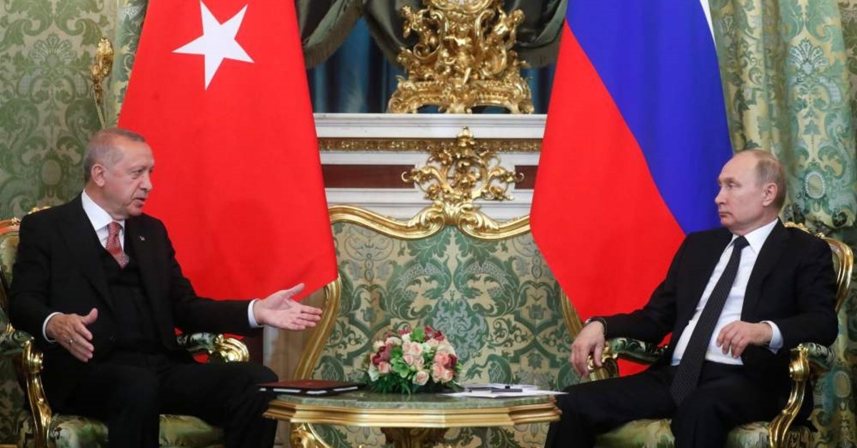President Recep Tayyip Erdou011fan (L) speaks with Russian President Vladimir Putin during their meeting at the Kremlin in Moscow, April 8, 2019.