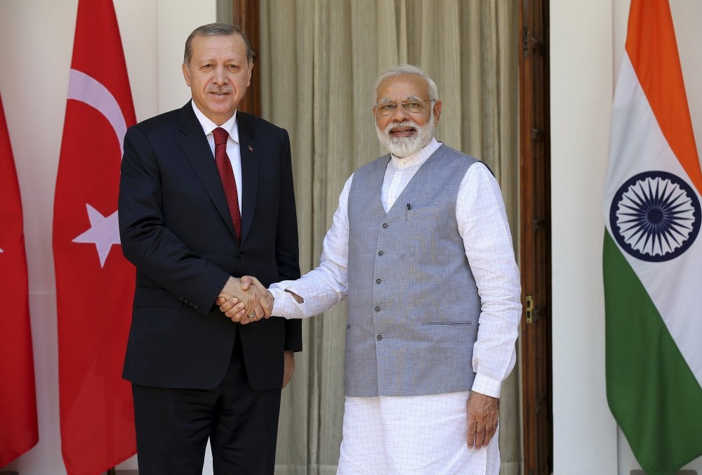 Turkish President Recep Tayyip Erdou011fan (L) and Indian Prime Minister Narendra Modi (R) shake hands upon their arrival at Hyderabad House prior to their meeting in New Delhi, India, May 1 2017.