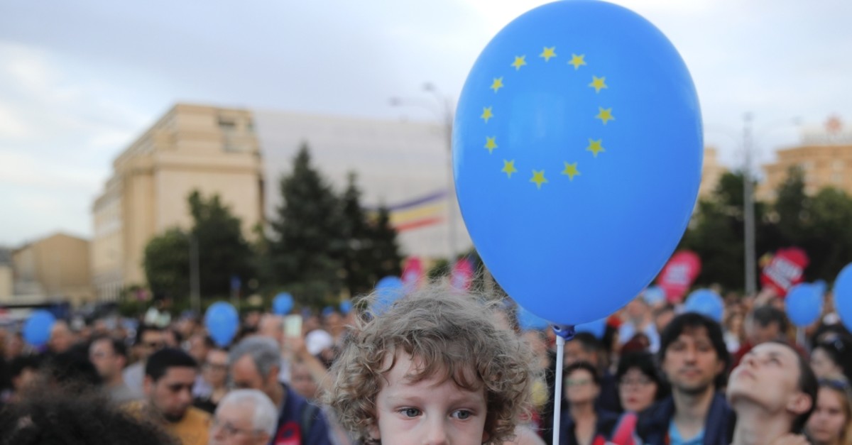 A child holds a balloon depicting the European Union flag, Bucharest, May 19, 2019.