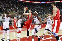 Myles Turner (C-R) of the USA in action against Cedi Osman (C-L) of Turkey during the U.S.-Turkey game in Shanghai, Sept. 3 2019.