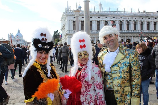 Dozens of people wearing costumes and masks fill the streets of Venice for the whole month of February. (Photo by Asene Asanova)