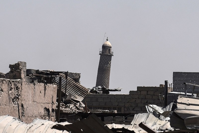 A picture taken on June 19, 2017 shows the leaning Al-Hadba minaret, which is part of the al-Nuri mosque as the Iraqi forces advance towards the Old City on June 19 (AFP Photo)