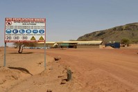 A sign is posted at the entrance of the Tambao mine in Tambao, 350 kilometers northeast of the capital, Ouagadougou on April 5, 2015, where five armed men kidnapped a Romanian mineworker the day before. (AFP)