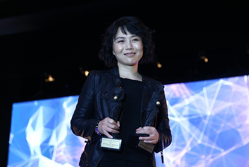 Chinese actress Wen Qi accepts The Best Film award for ,Angels Wear White, at the 54th Antalya Film Festival, Antalya, Turkey, Oct. 27, 2017. (AA Photo)