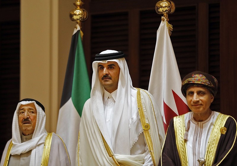 This file photo taken on 12.07.2016 shows Emir of Kuwait Sabah al-Ahmad al-Jaber al-Sabah (L), Emir of Qatar Sheikh Tamim bin Hamad al-Thani (C) and Oman's Foreign Minister Yusuf bin Alawi attending a Gulf Cooperation Council (GCC) summit (AFP Photo)