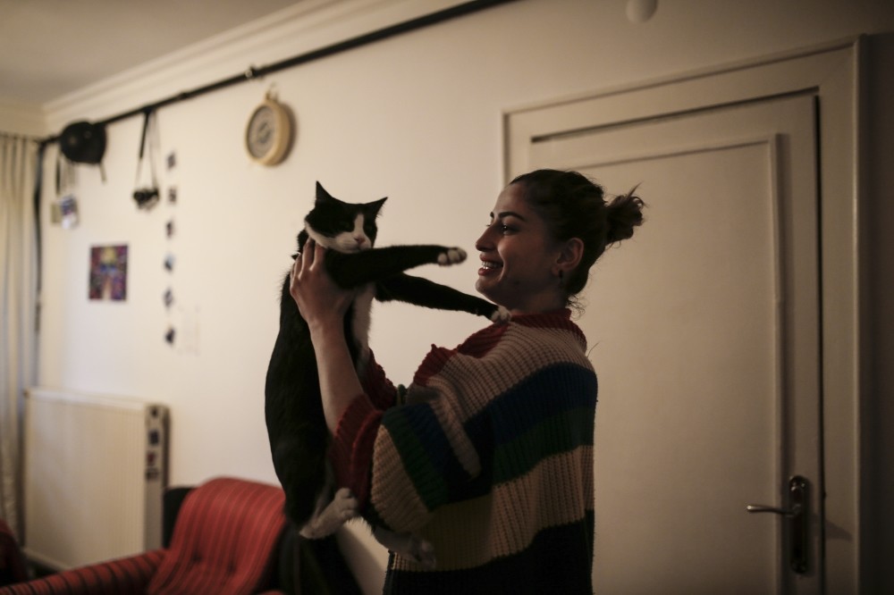 u00d6zge Kara spends her nights at home playing with her cats and knitting.