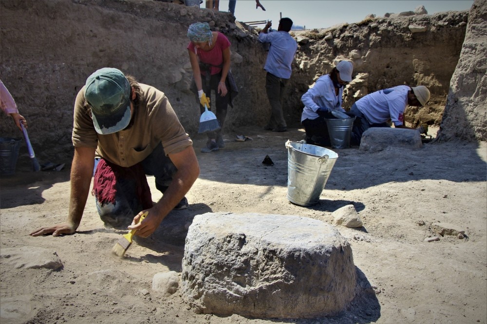 A photo showing  the excavation of the Persian palace's columns.