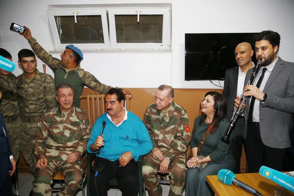 Chief of General Staff Gen. Akar (L), singer u0130brahim Tatlu0131ses (2-L), President Erdou011fan (2-R) and clarinetist Serkan u00c7au011fru0131 (R), sing in a military barrack Hatay, April 1.