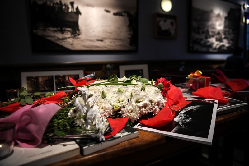 Flowers and portraits of late Turkish photographer Ara Güler have been put where he used to stay, at Ara Cafe in Istanbul, on October 19, 2018.