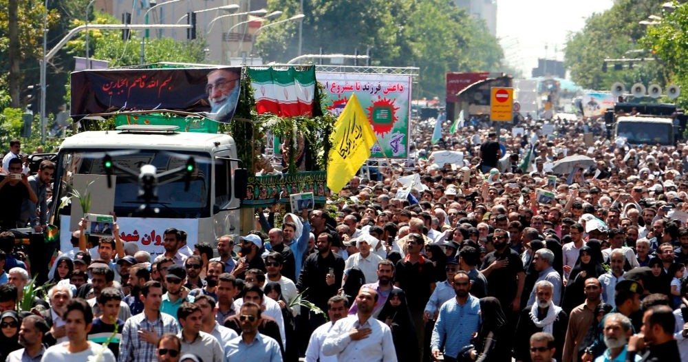 Iranians march during the funeral of the victims of the twin attacks in the capital Tehran on June 9.