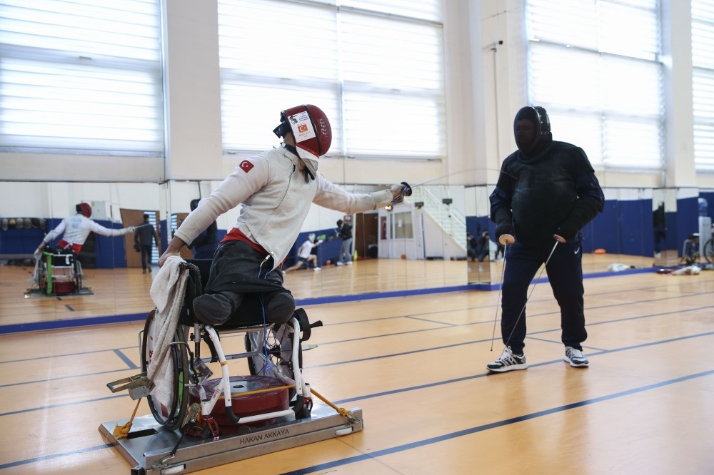 Hakan Akkaya (L) in a training session. the 26-year-old athlete is eyeing title in the 2020 Tokyo Paralympics.