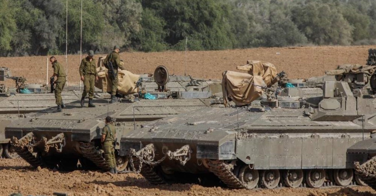 Israeli soldiers stand on armored vehicles near the border with the Gaza Strip, Nov. 13, 2019. (AFP Photo)