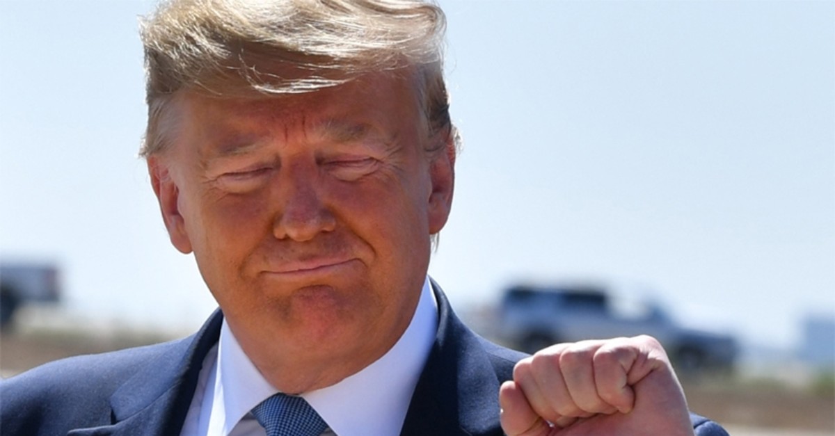 US President Donald Trump gestures after landing at San Diego International Airport in San Diego, California, on September 18, 2019. 
