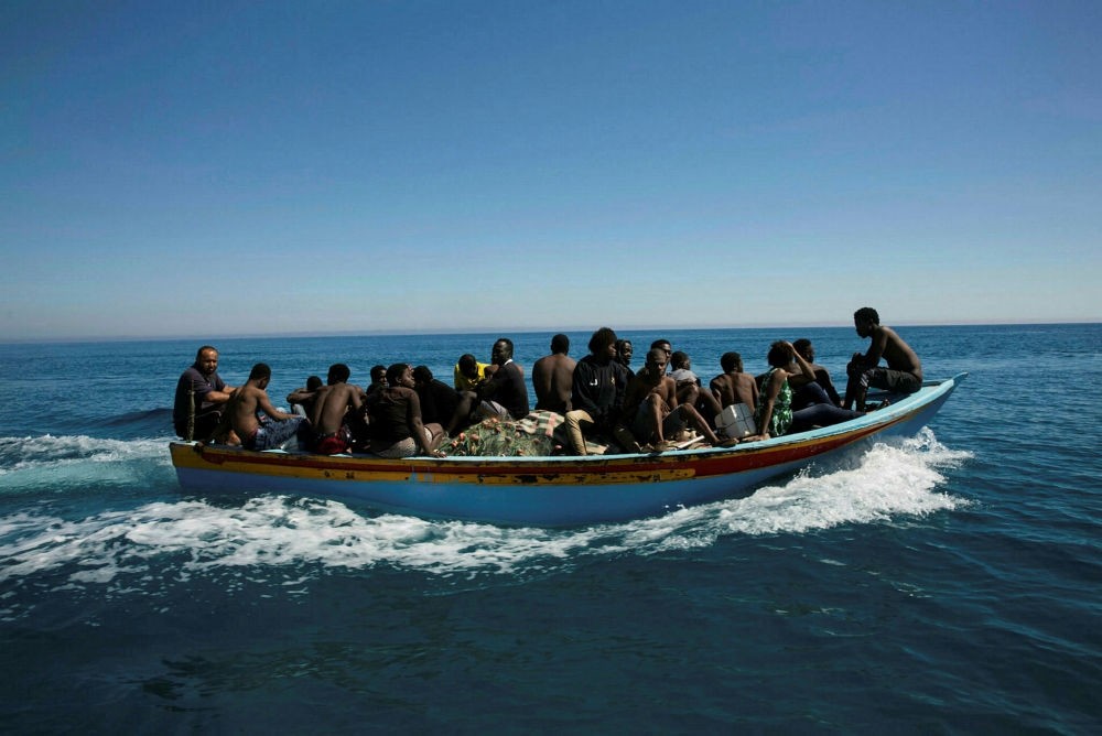 Migrants are transported after being rescued by the Libyan coast guard in the Mediterranean off Tripoli, July 8, 2017.