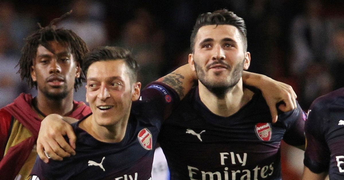 In this May 9, 2019 file photo, Arsenal defender Sead Kolasinac (R) celebrates with Arsenal midfielder Mesut u00d6zil at the end of the Europa League semifinal match in Valencia, Spain. (AP Photo)
