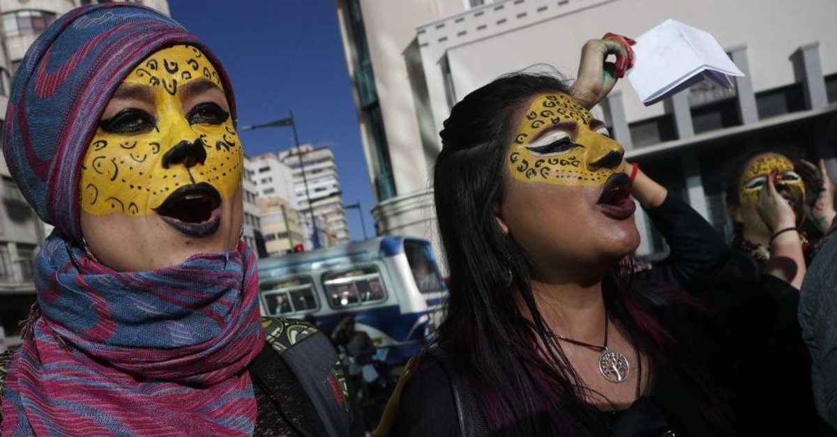 Activists with their faces painted like jaguars protest the reelection of President Evo Morales, in La Paz, Bolivia, Wednesday, Oct. 30, 2019. (AP Photo)