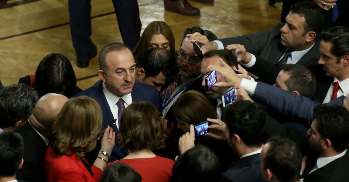 Foreign Minister Mevlu00fct u00c7avuu015fou011flu answers the questions of journalists during a reception held for the 99th anniversary of the foundation of the Turkish Grand National Assembly (TGNA), Ankara, April 23, 2019.