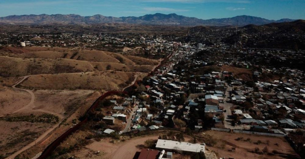 The U.S. border fence separates Nogales, Mexico, right, from sister city Nogales, Arizona, left, Friday, Jan. 3, 2020. (AP Photo)