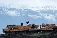 Turkish soldiers train with tanks and armored vehicles near the Turkish-Syrian border, Hatay, Jan. 24. 