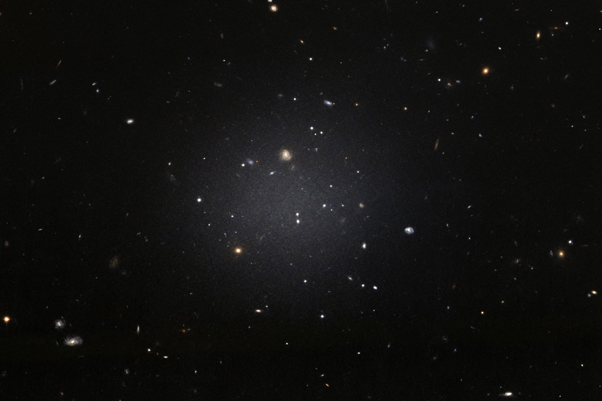 This handout image released by the European Space Agency (ESA) from the NASA/ESA Hubble Space Telescope shows the NGC 1052-DF2 galaxy which is missing most, if not all, of its dark matter. (AFP Photo)