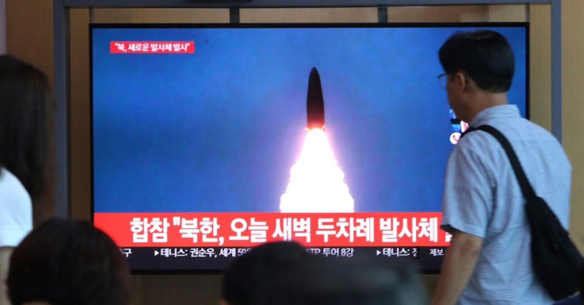 People watch a TV showing a file footage of a North Korea's missile launch during a news program at the Seoul Railway Station in Seoul, South Korea, Friday, Aug. 2, 2019. (AP Photo)
