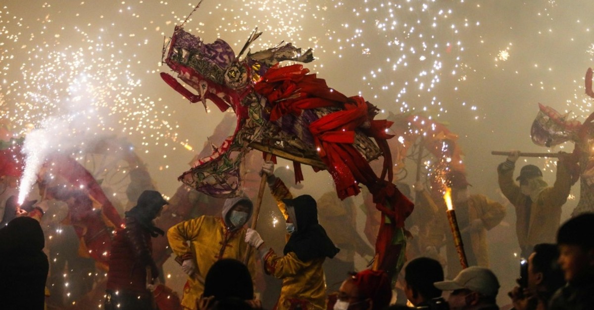Onlookers watch a dragon dance to celebrate the upcoming Lantern Festival u2013 the climax of the Chinese New Year; Zunyi, China's southwestern Guizhou province, Feb. 16, 2019.