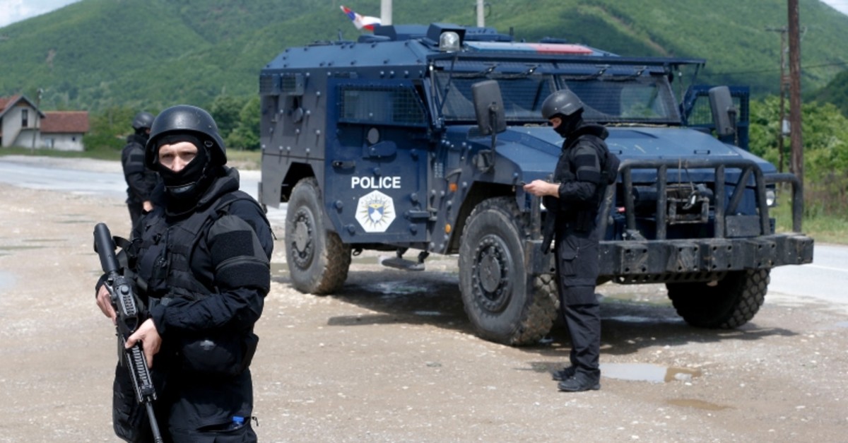 Kosovo police special unit members secure the area near the village of Cabra, north western Kosovo, during an ongoing police operation on Tuesday, May 28, 2019. (AP Photo)