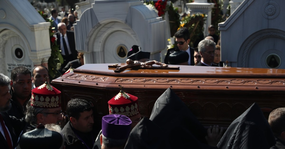 People carry the coffin of Patriarch Mesrob II at his a funeral in Istanbul, March 17, 2019.