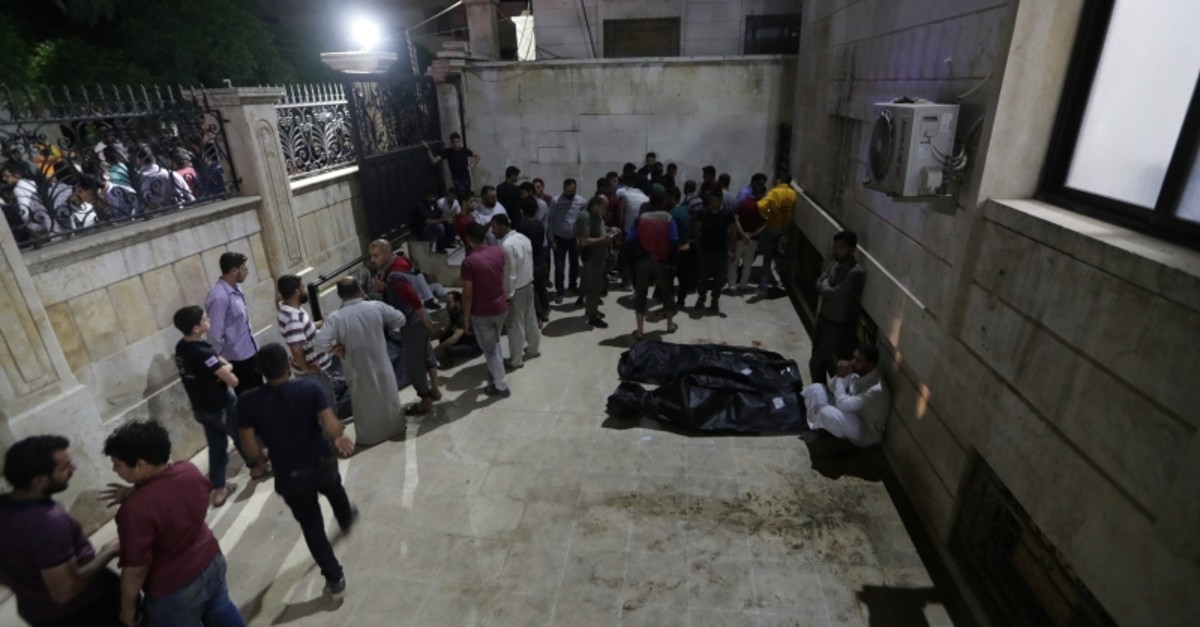 People gather at a site of a car bomb blast in Azaz, Syria June 2, 2019. (Reuters Photo)