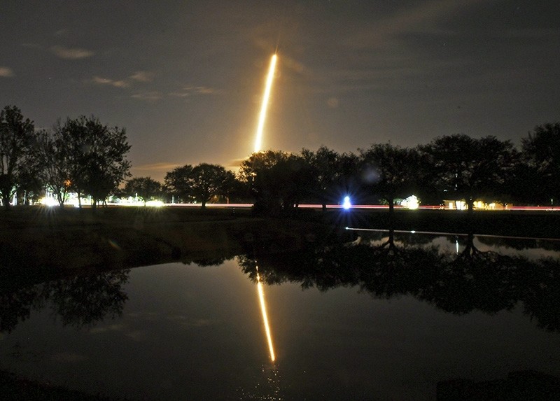 In this image made with a long exposure the SpaceX Falcon 9 rocket launches from Cape Canaveral Air Force Station as seen from in Viera, Fla. (Tim Shortt/Florida Today via AP)