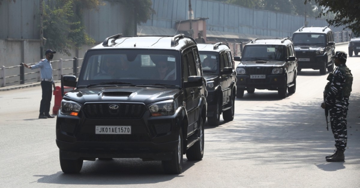 An Indian paramilitary soldier guards as a convoy of European Parliament members delegation pass in Srinagar, Indian controlled Kashmir, Tuesday, Oct. 29, 2019. (AP Photo)