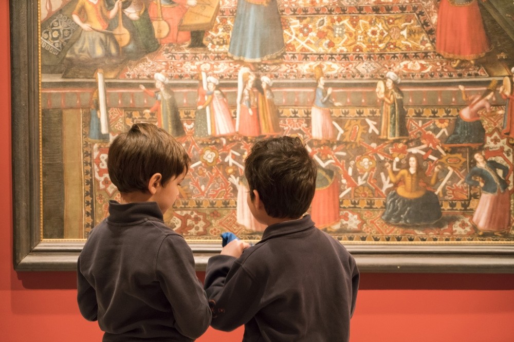 Paintings at the u201cIntersecting Worlds: Ambassadors and Paintersu201d collection inspire children during the fairytales events.