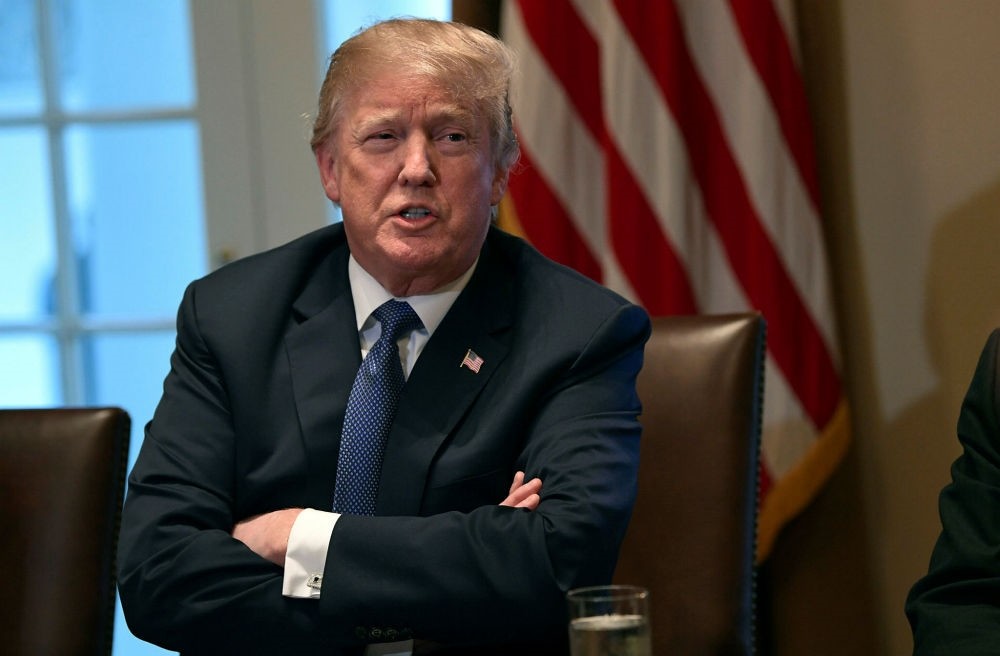 U.S. President Donald Trump speaks in the Cabinet Room of the White  House in Washington at the start of a meeting with military leaders, April 9.